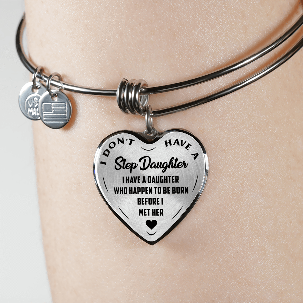I DON'T HAVE A STEPDAUGHTER, BORN BEFORE I MET HER, SILVER OR GOLD FINISHED HEART SHAPED BANGLE BRACELET (BLACK ON TRANSPARENT) - podprintz.com