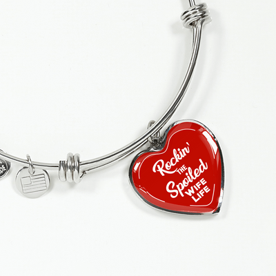 ROCKIN' THE SPOILED, WIFE LIFE - SILVER AND GOLD FINISHED HEART SHAPED BANGLE BRACELET (WHITE TEXT ON RED) - podprintz.com