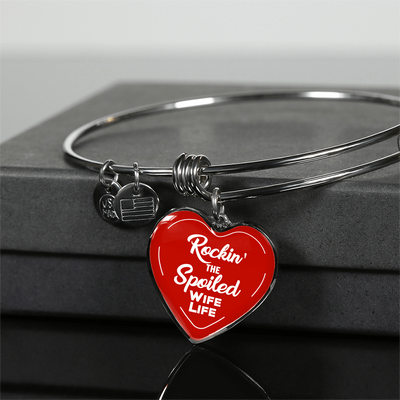 ROCKIN' THE SPOILED, WIFE LIFE - SILVER AND GOLD FINISHED HEART SHAPED BANGLE BRACELET (WHITE TEXT ON RED) - podprintz.com