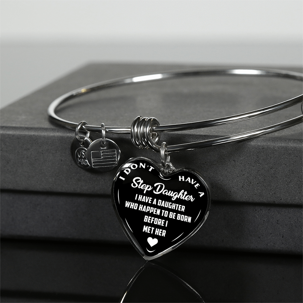 I DON'T HAVE A STEPDAUGHTER, BORN BEFORE I MET HER, SILVER OR GOLD FINISHED HEART SHAPED BANGLE BRACELET (WHITE ON BLACK) - podprintz.com