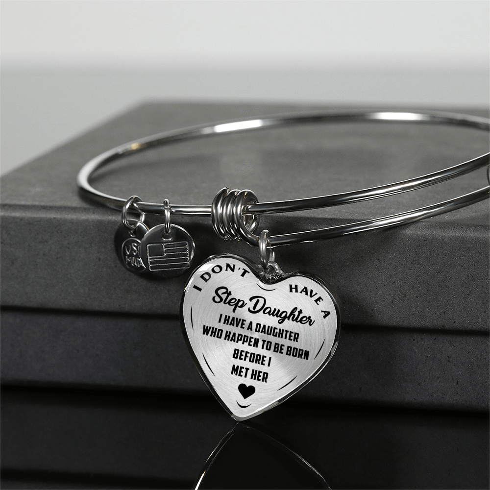 I DON'T HAVE A STEPDAUGHTER, BORN BEFORE I MET HER, SILVER OR GOLD FINISHED HEART SHAPED BANGLE BRACELET (BLACK ON TRANSPARENT) - podprintz.com