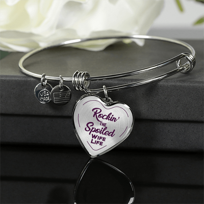 ROCKIN' THE SPOILED, WIFE LIFE - SILVER AND GOLD FINISHED HEART SHAPED BANGLE BRACELET (PURPLE TEXT ON TRANSPARENT) - podprintz.com