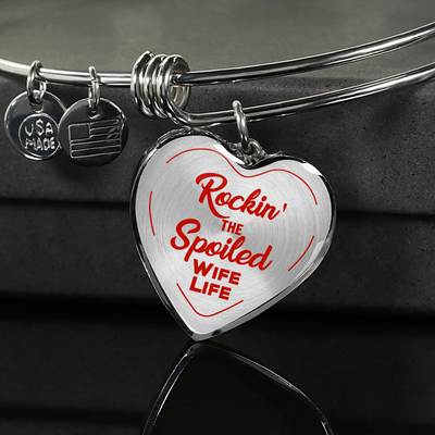 ROCKIN' THE SPOILED, WIFE LIFE - SILVER AND GOLD FINISHED HEART SHAPED BANGLE BRACELET (RED TEXT ON TRANSPARENT) - podprintz.com