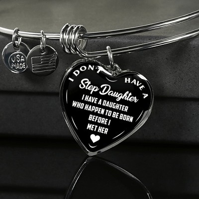 I DON'T HAVE A STEPDAUGHTER, BORN BEFORE I MET HER, SILVER OR GOLD FINISHED HEART SHAPED BANGLE BRACELET (WHITE ON BLACK) - podprintz.com