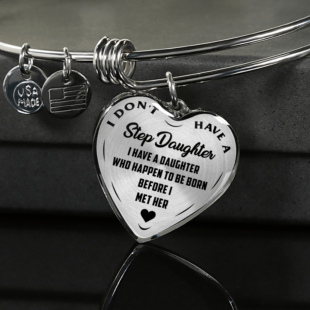 I DON'T HAVE A STEPDAUGHTER, BORN BEFORE I MET HER, SILVER OR GOLD FINISHED HEART SHAPED BANGLE BRACELET (BLACK ON TRANSPARENT) - podprintz.com