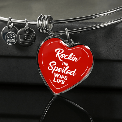 ROCKIN' THE SPOILED, WIFE LIFE - SILVER AND GOLD FINISHED HEART SHAPED BANGLE BRACELET (WHITE TEXT ON RED) - podprintz.com
